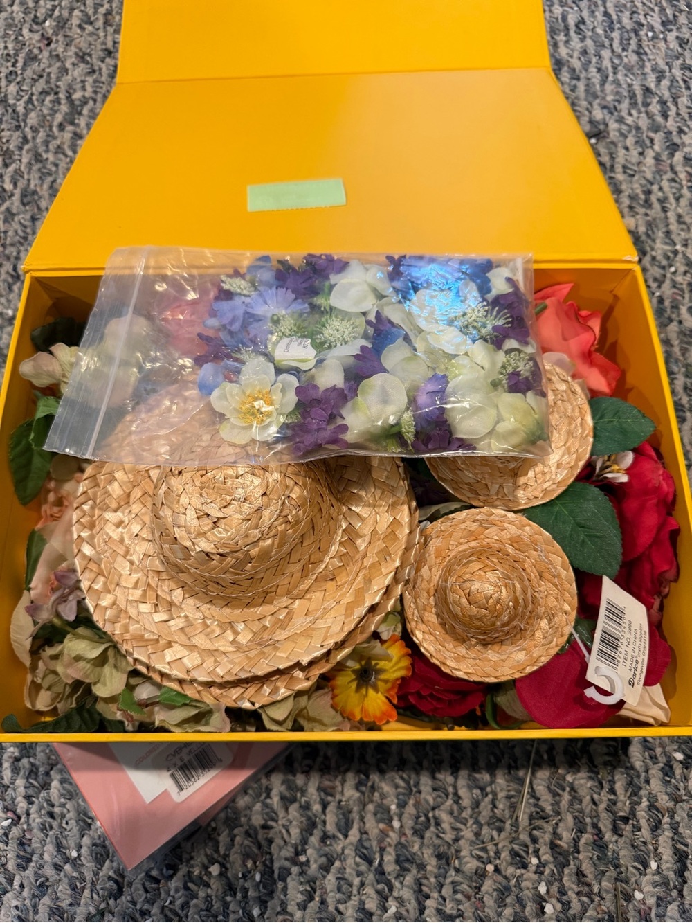Bundle of flowers and straw hats for art and crafts